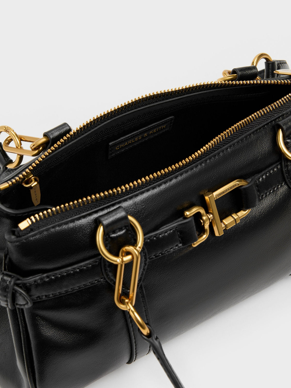 CHARLES & KEITH Customer Favorite / Gwynne Metallic-Accent Elongated Shoulder Bag - Black