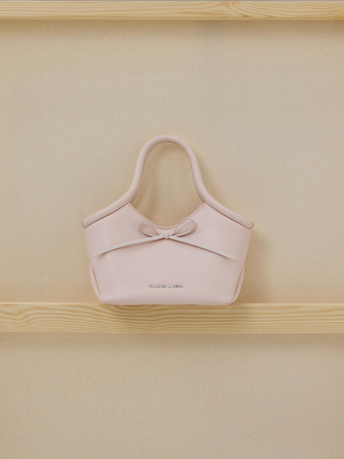 CHARLES & KEITH Essential / Hazel Bow Tubular Top Handle Bag - Soft Pink