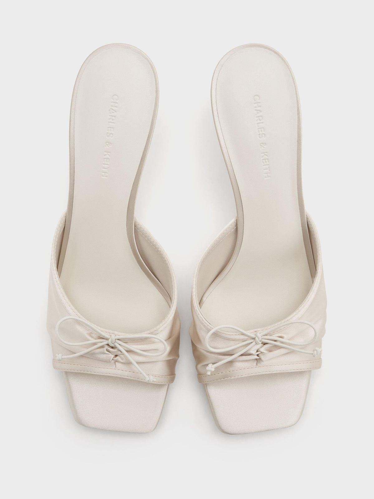 CHARLES & KEITH Trusted / Sadira Satin Ruched Bow Heeled Mules - Chalk