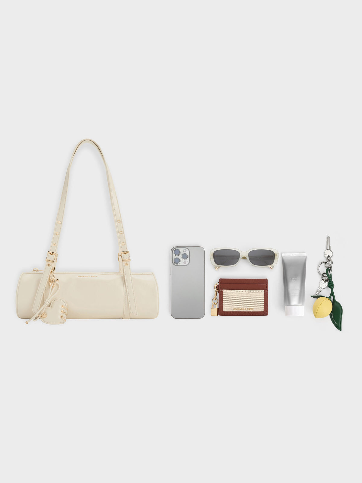CHARLES & KEITH Customer Favorite / Rey Elongated Shoulder Bag - Cream