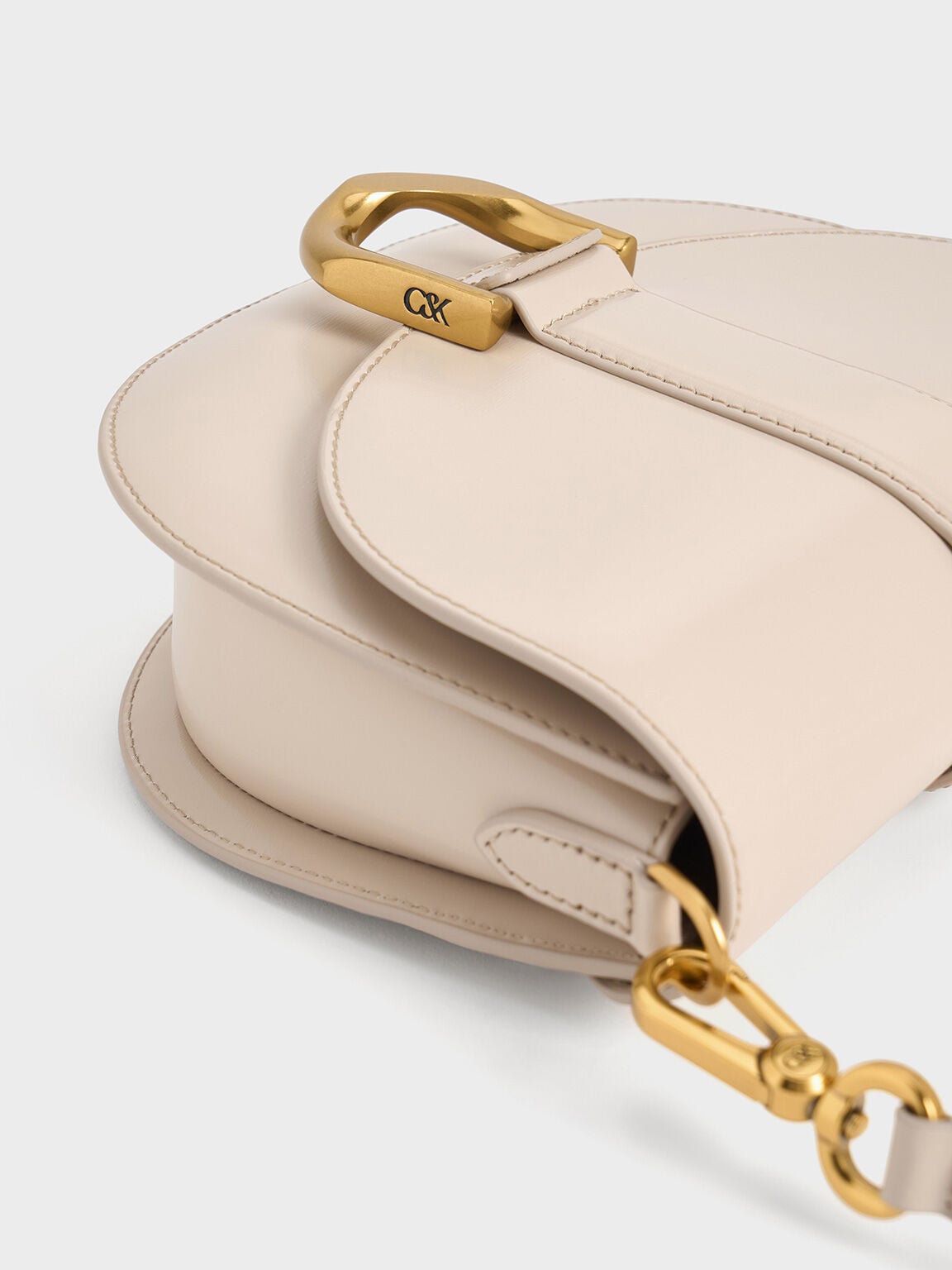 CHARLES & KEITH Deals / Gabine Leather Saddle Bag - Oat
