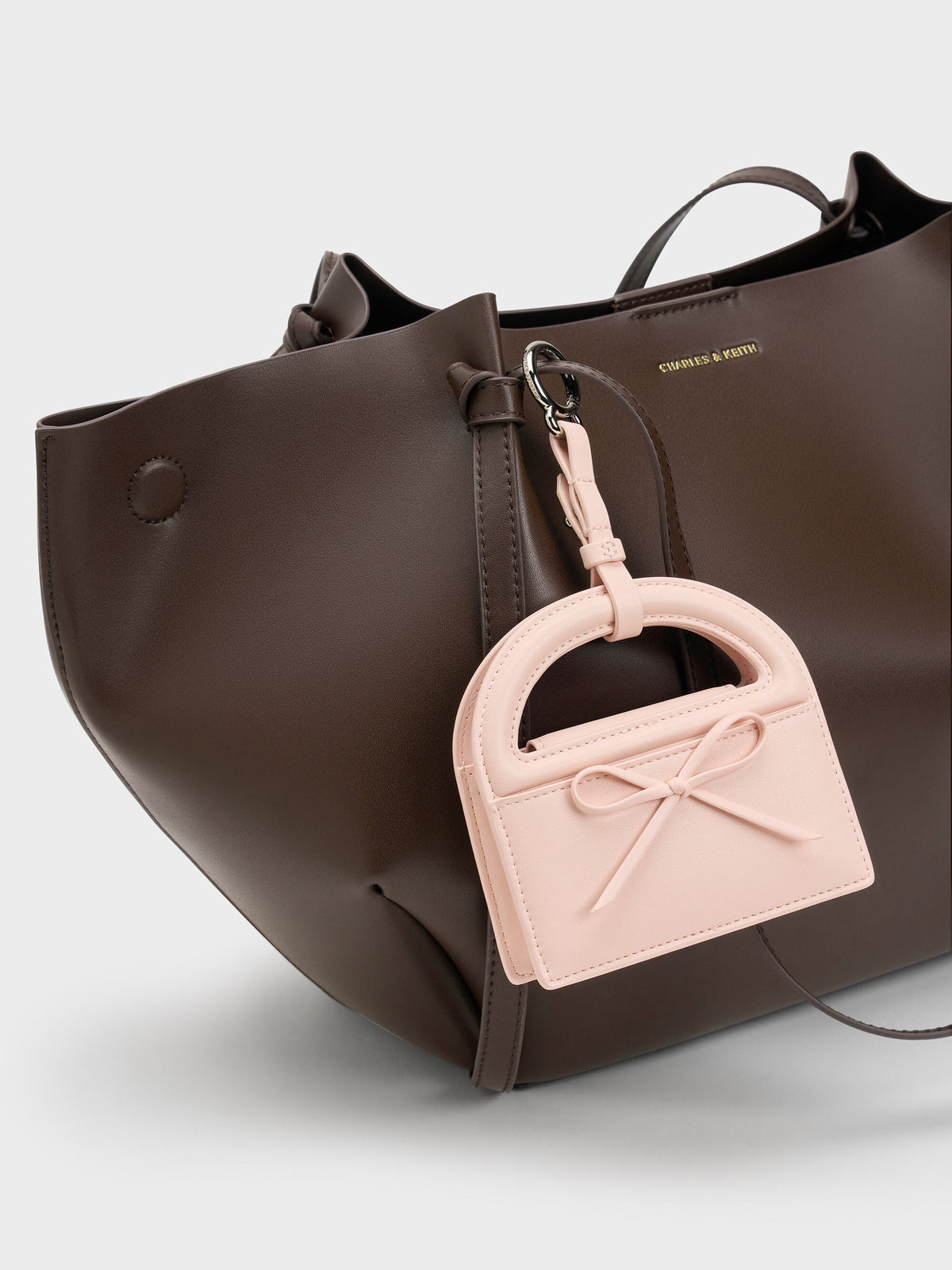 CHARLES & KEITH Signature / Reese Bow Top Handle Wristlet - Soft Pink