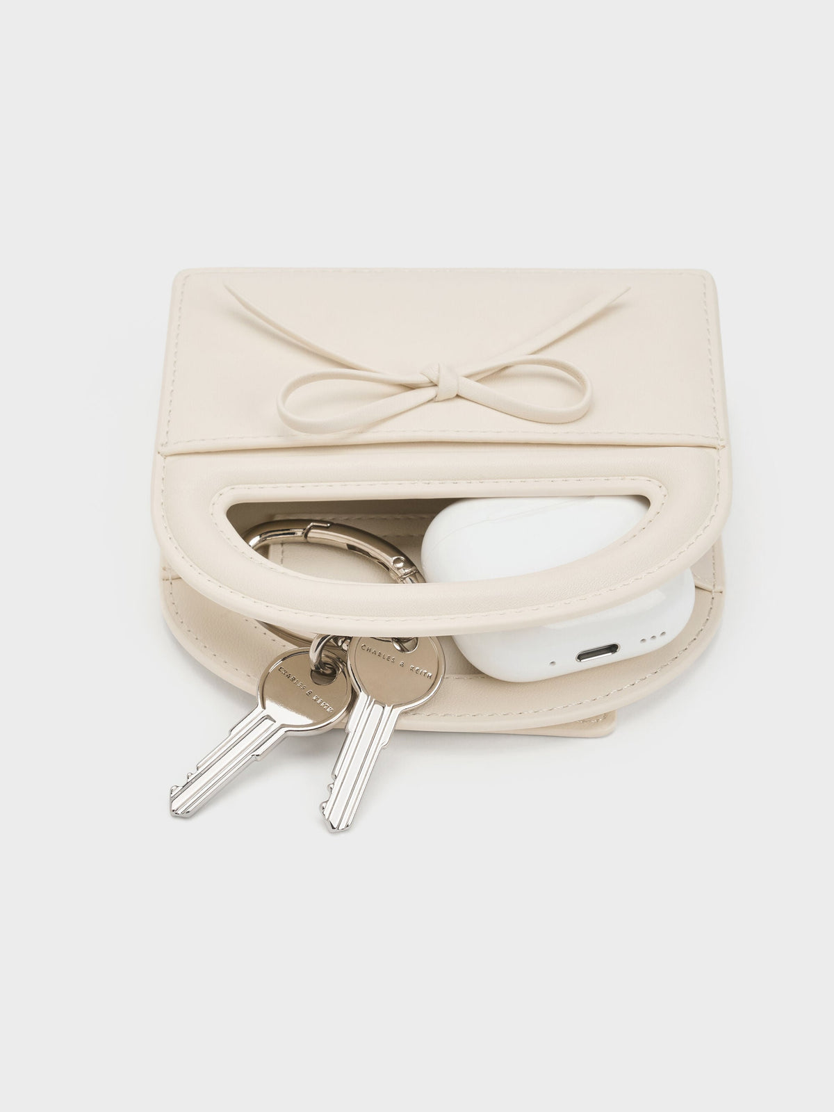 CHARLES & KEITH Smart Buy / Reese Bow Top Handle Wristlet - Cream