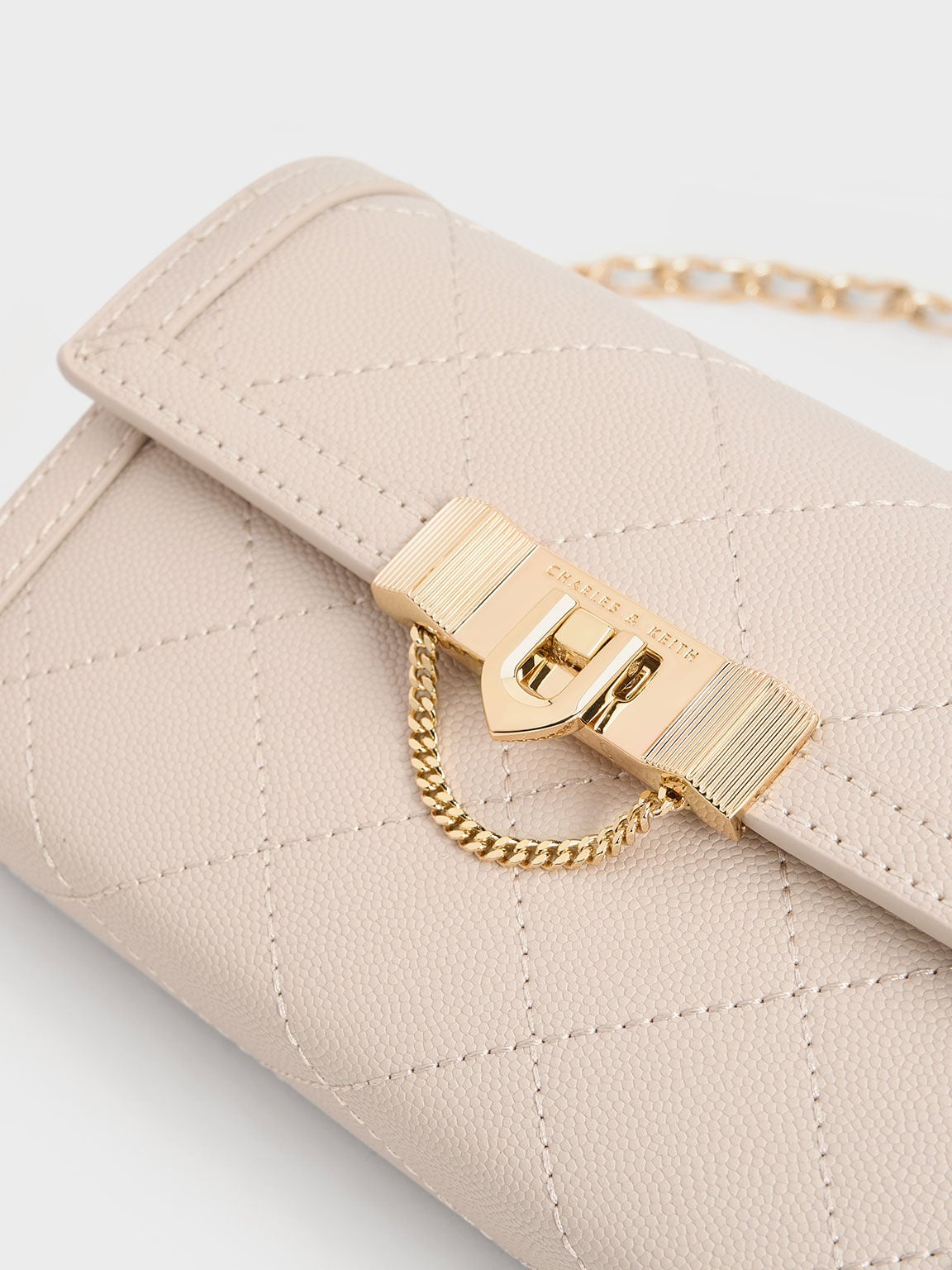 CHARLES & KEITH Premium / Tallulah Quilted Push-Lock Clutch - Oat