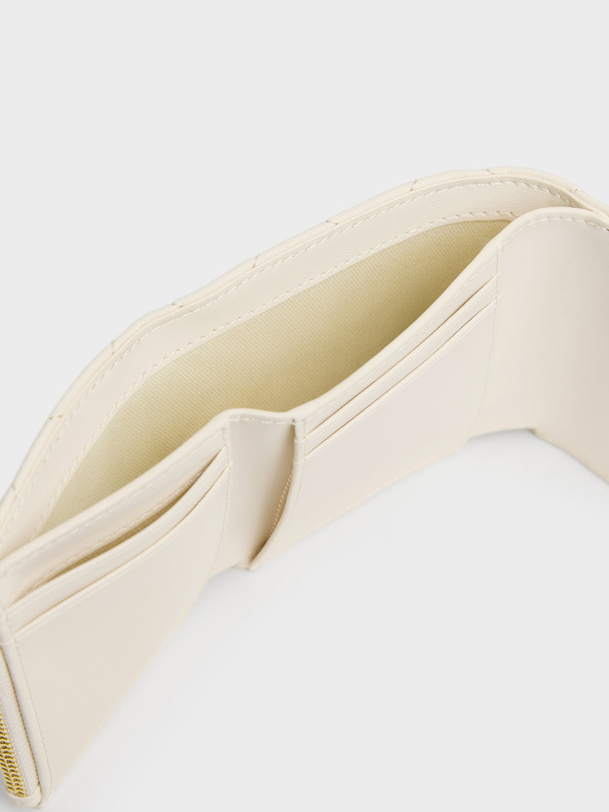 CHARLES & KEITH Essential / Arrietty Quilted Curved-Flap Wallet - Cream